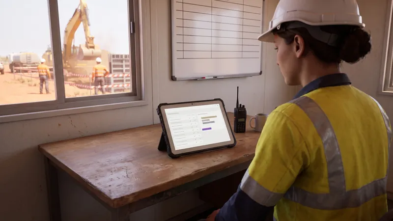 In the module: a supervisor in a site office reviews a session record on a tablet