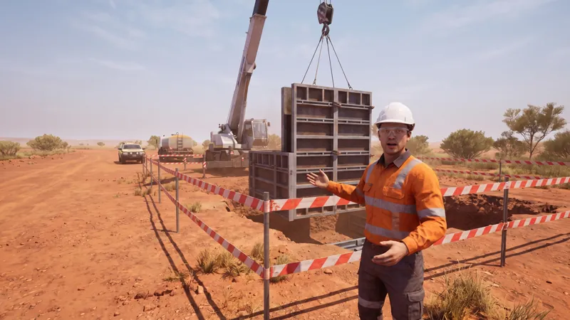 In the module: a rigger faces the trainee and explains the exclusion zone around a crane lift